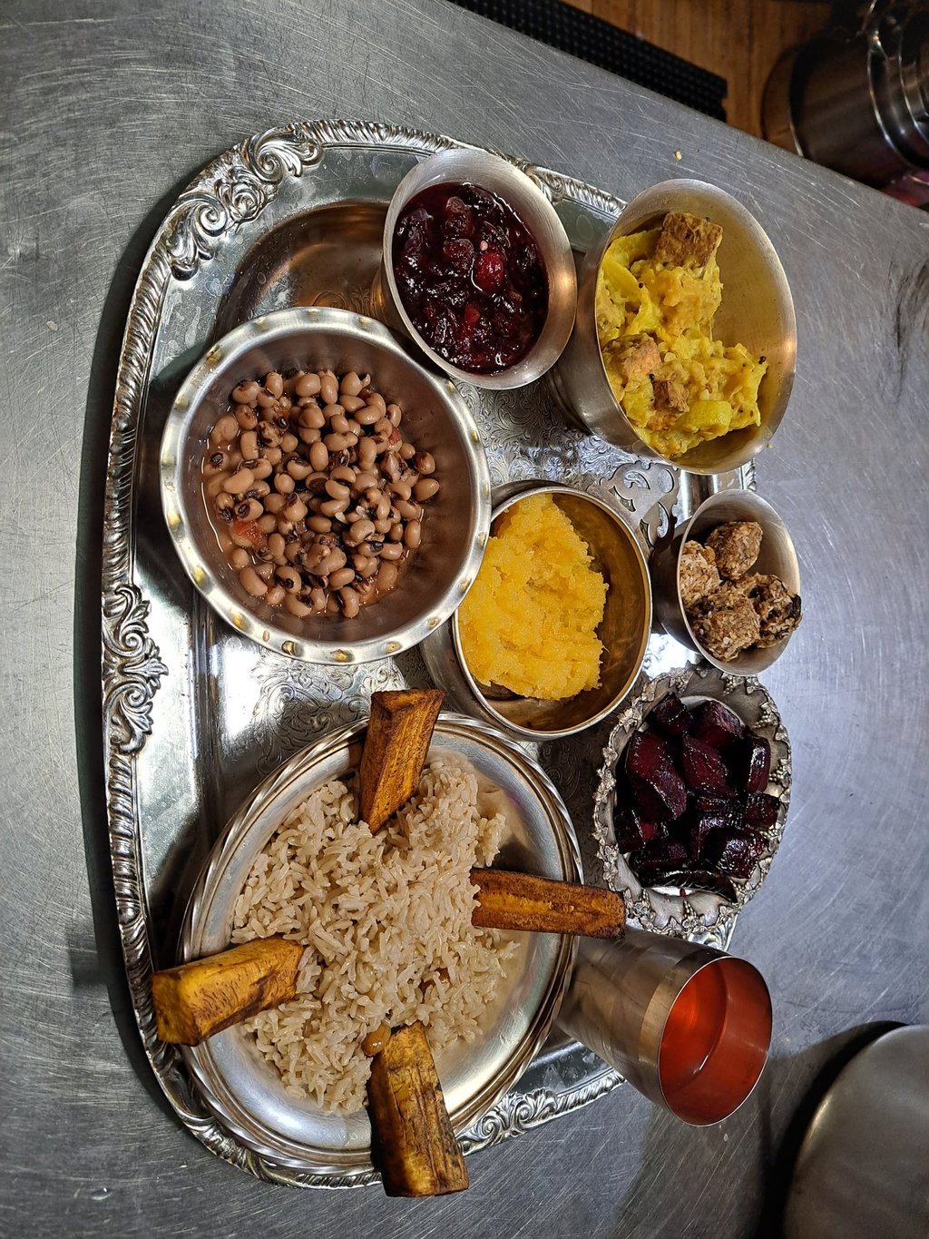 Hare Krishna Prasadam offering tray with vegetarian food in each section