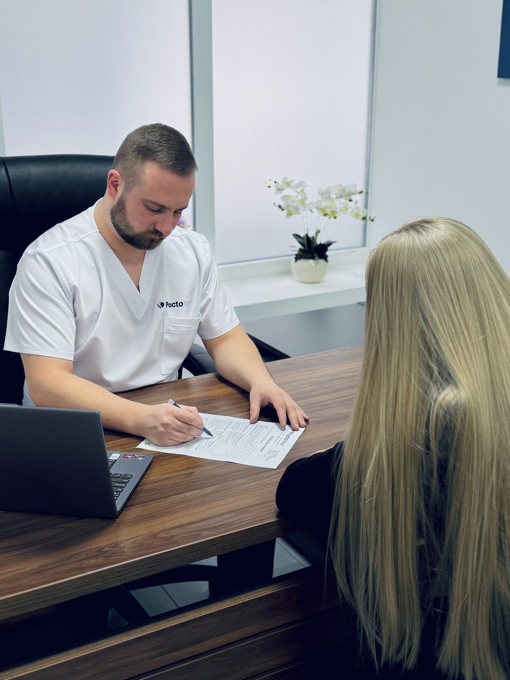 Proctologist Andrii Yaroshchuk conducting a private patient consultation in Rivne.