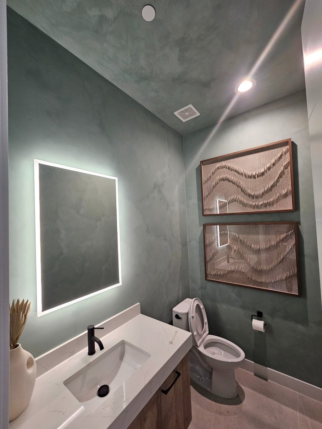 Modern bathroom with a textured limewash finish, creating a sleek and elegant in an Arizona home