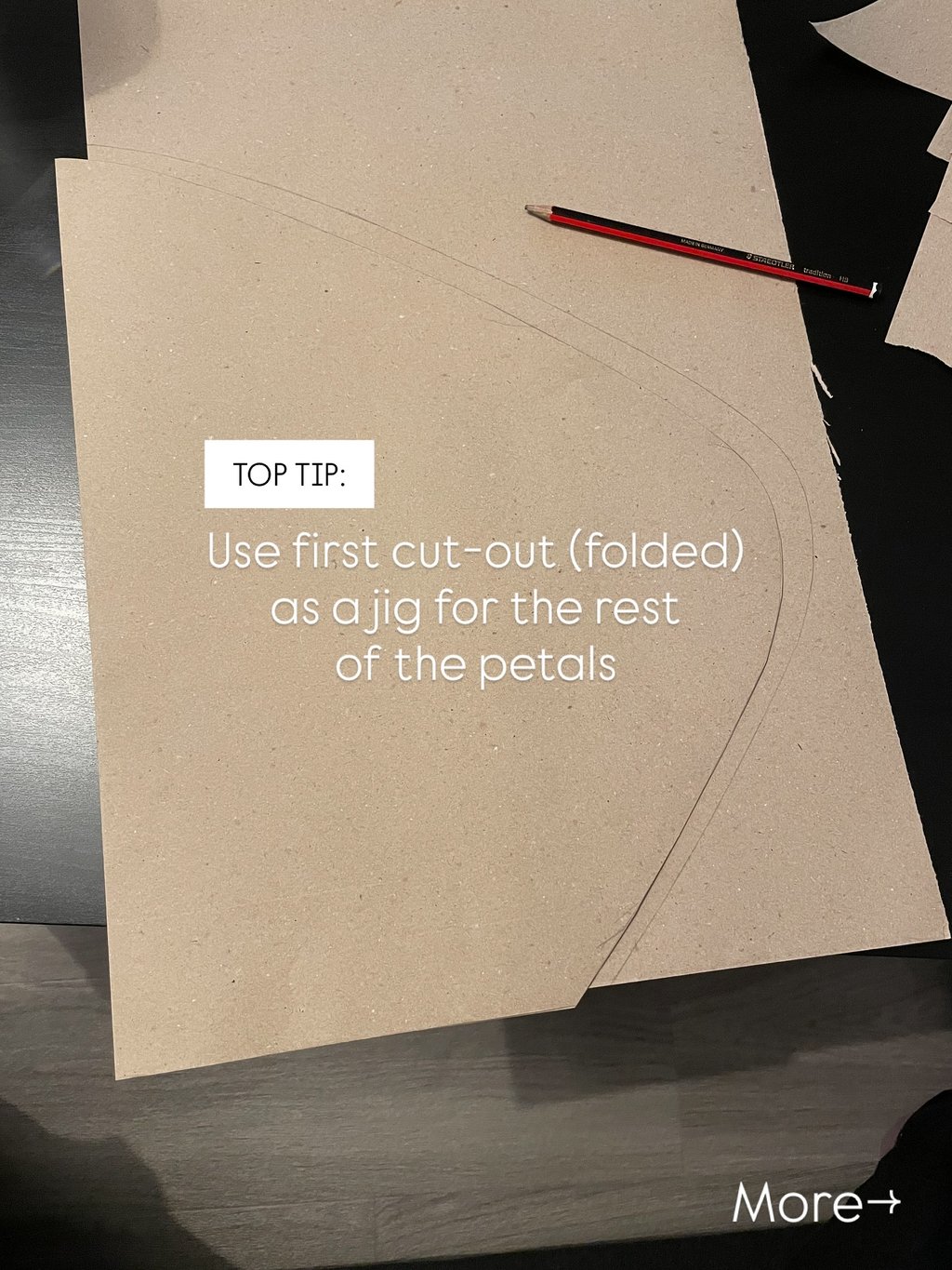 brown paper petal folded in half to use as a jig or mould