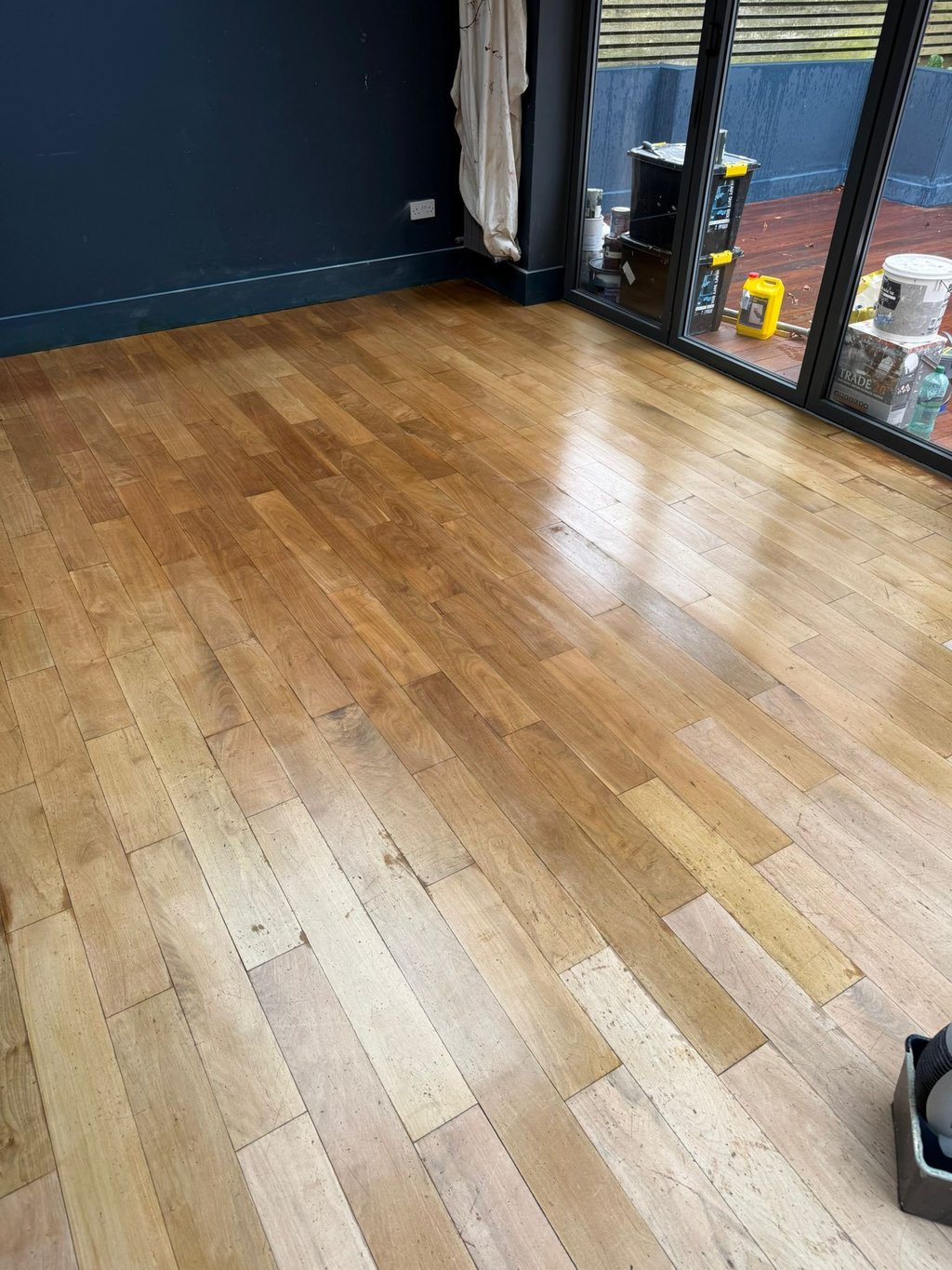  Living room installed and refinished light oak hardwood flooring with a polished finish in Sussex. 