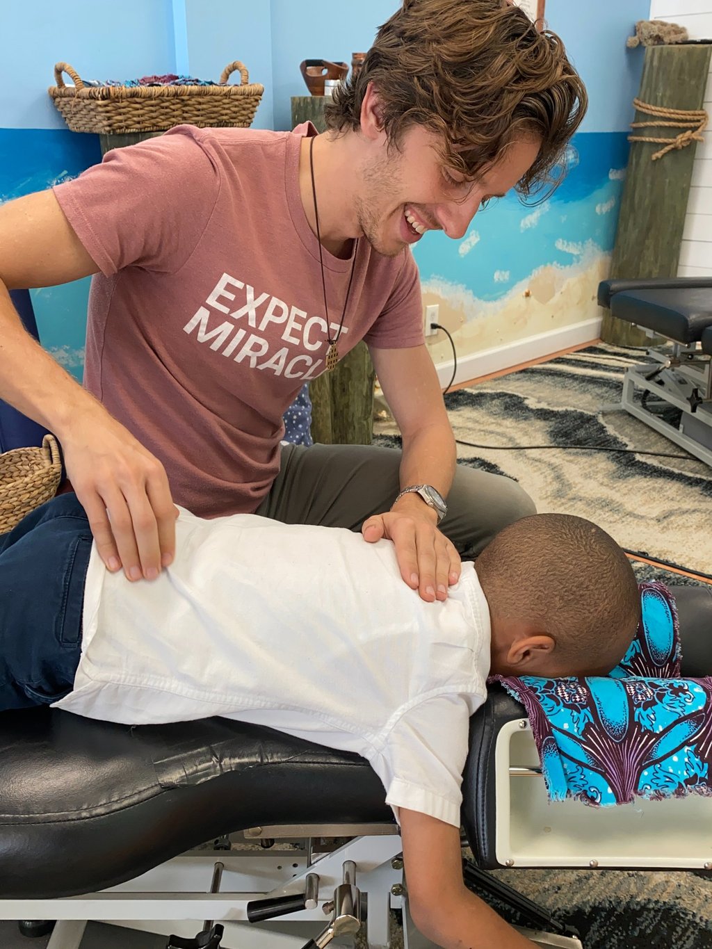 Young child getting adjusted by Franklin pediatric chiropractor