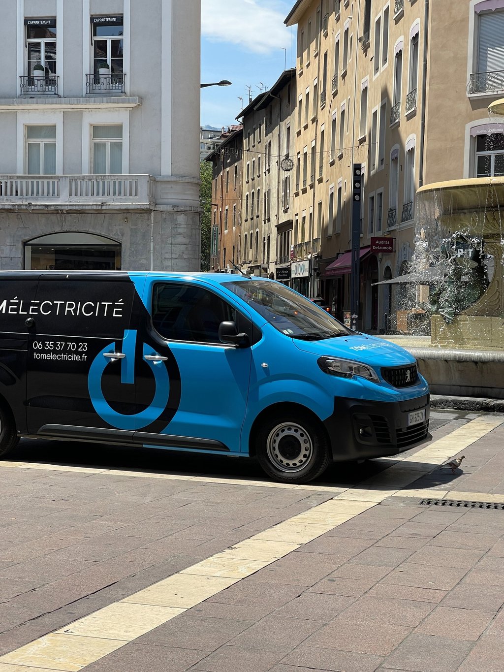 a van with electric charging station on the side of the road