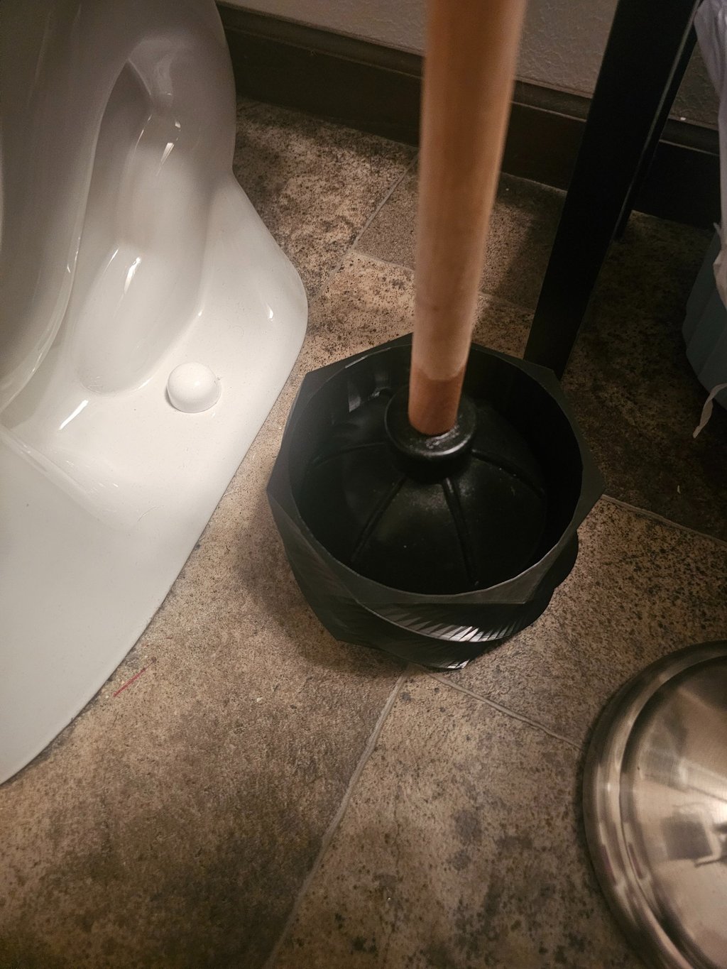 Helix Basin plunger cup in bathroom.