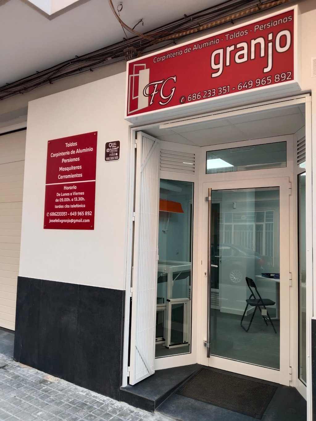 Granjo workshop storefront for aluminum carpentry, blinds, and awnings in Spain.