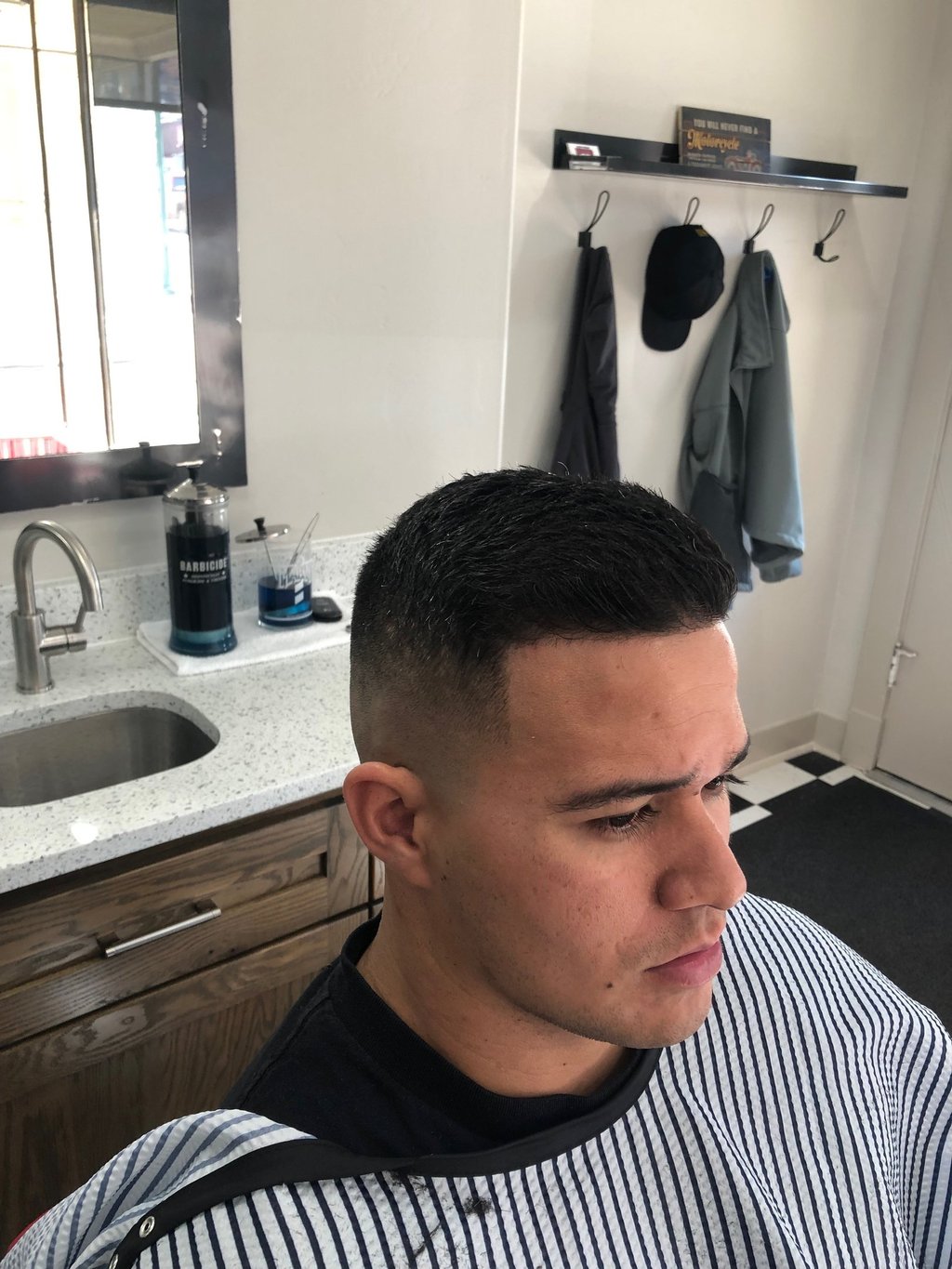 A man's haircut at Main Street Barber