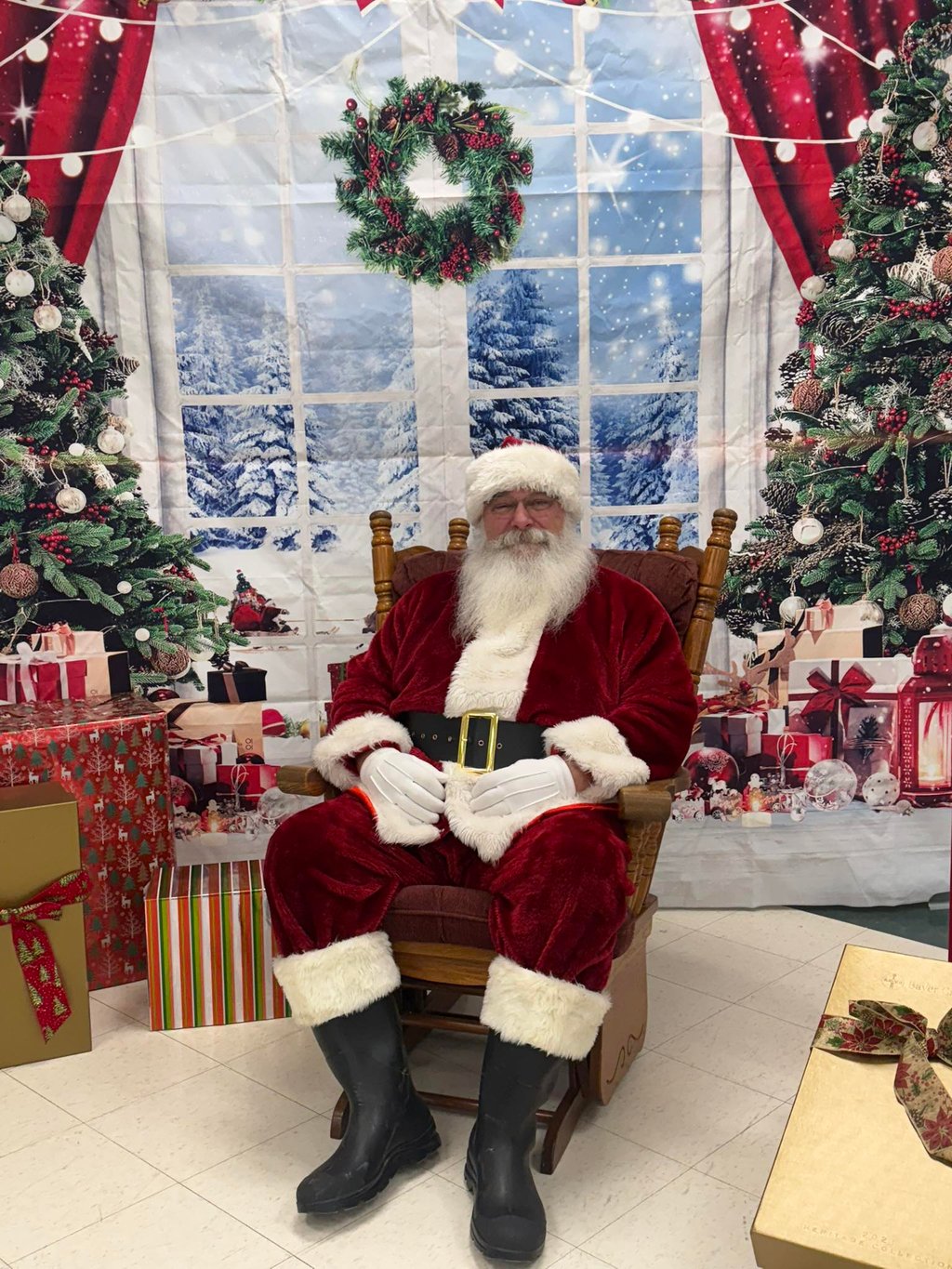Santa Tom sitting in a rocking chair