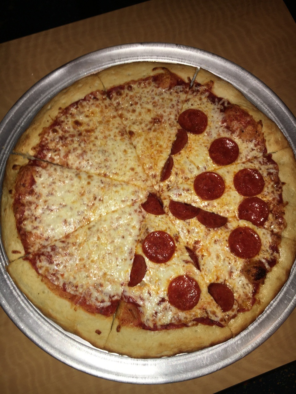 half cheese half pepperoni pizza