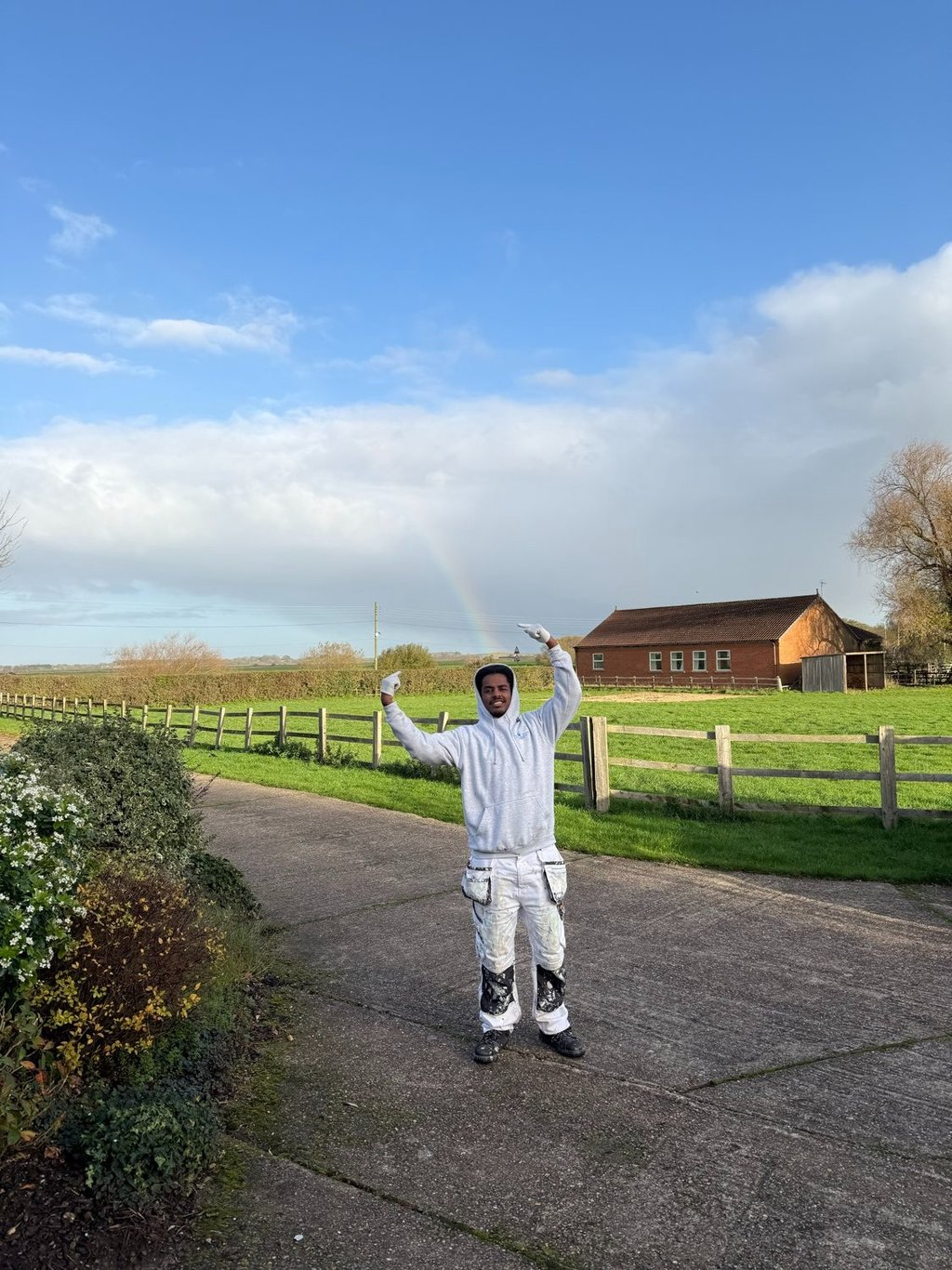 A staff member posing outside a property.