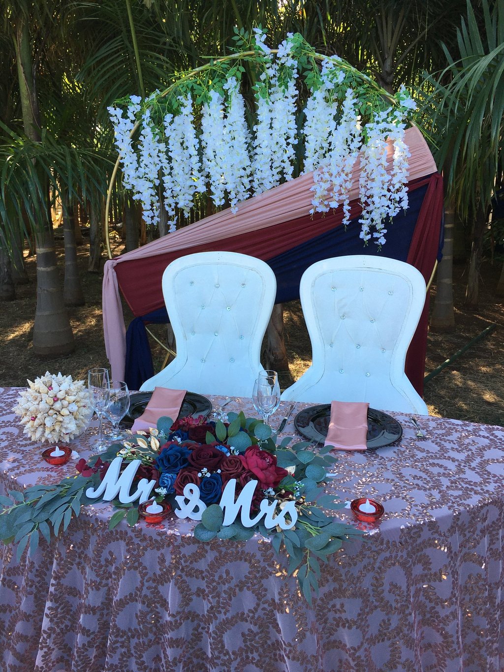 a table with a table cloth and chairs