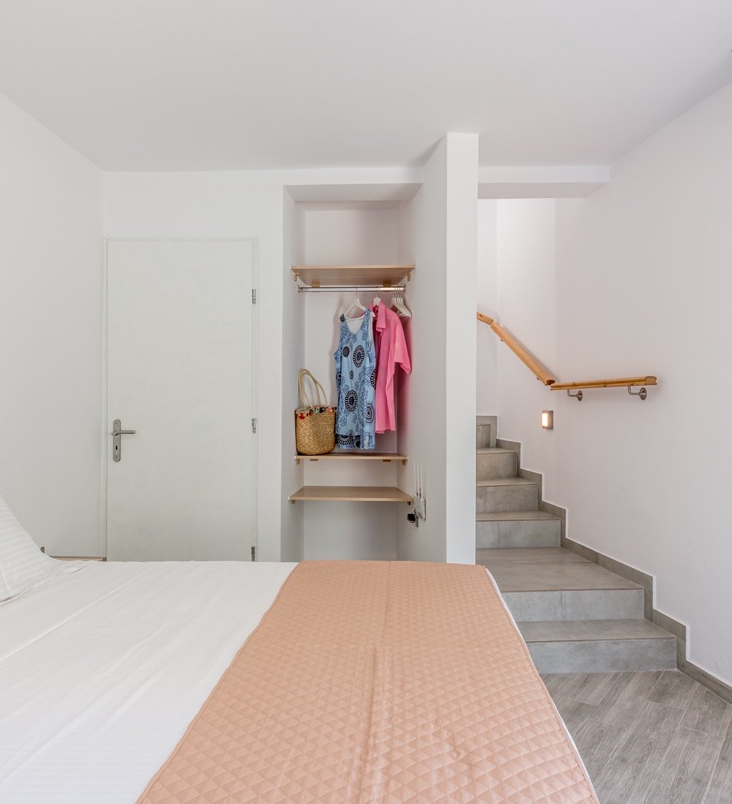 a bedroom with a bed and a closet