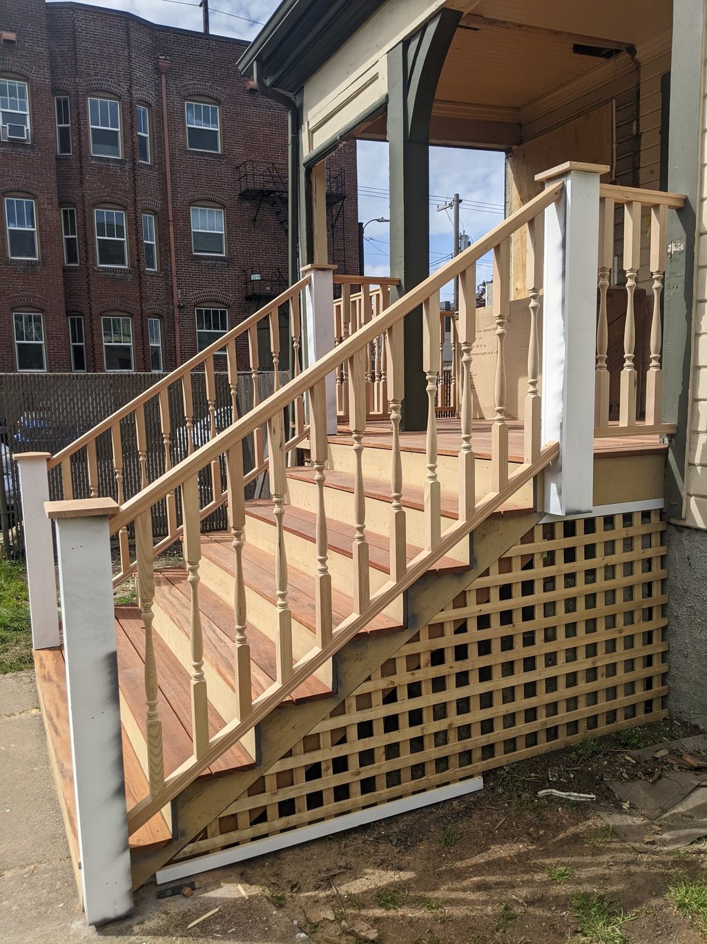 Front porch made from Tiger Wood and traditional wood spindle handrail