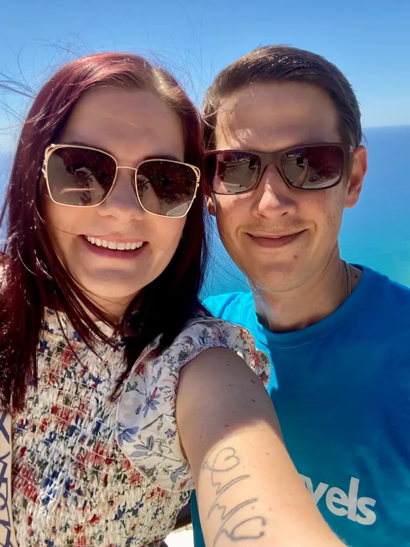 a man and woman taking a selfie with a selfie