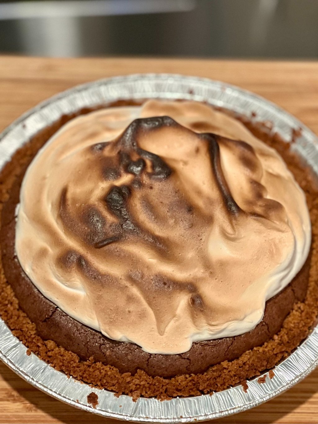 6-inch S'mores Brownie Pie topped with toasted Swiss meringue on a graham cracker crust.