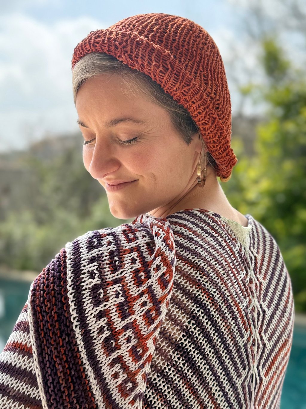 Sophie wearing her shawl in hand-dyed eco-friendly yarn