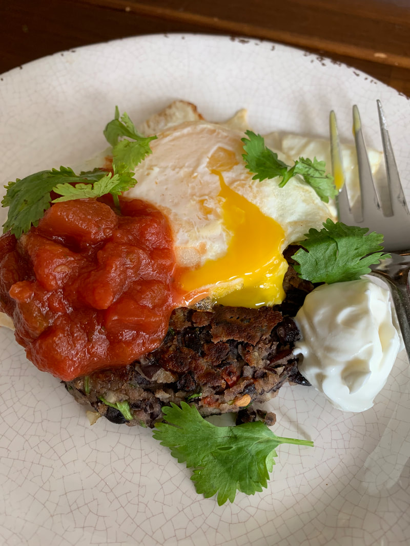 black bean burger with runny egg, salsa and cilantro