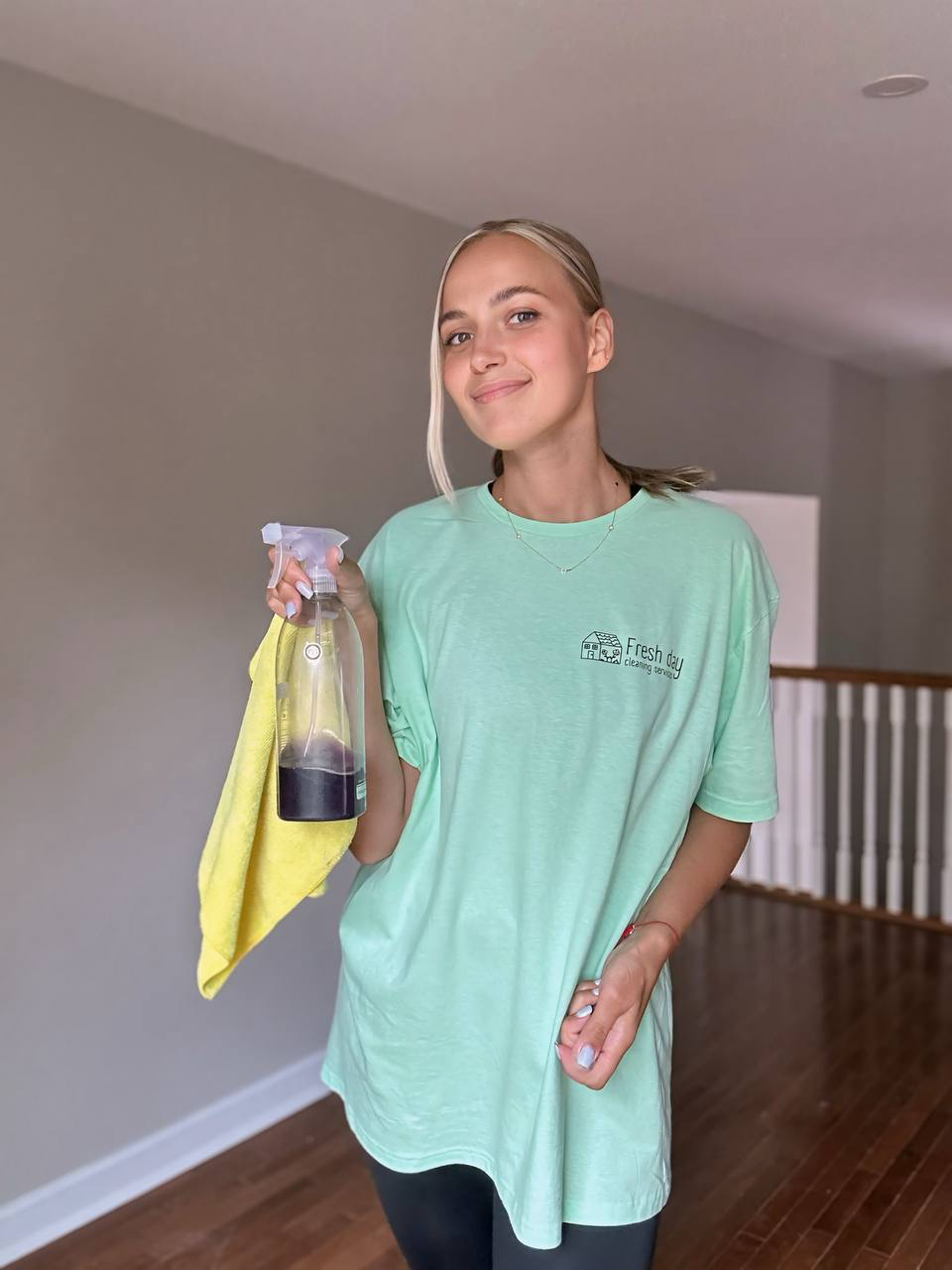 A professional cleaner displays a cleaning product