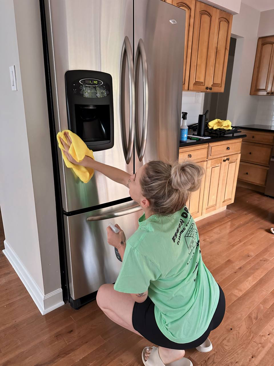 A professional cleaner thoroughly cleans the fridge