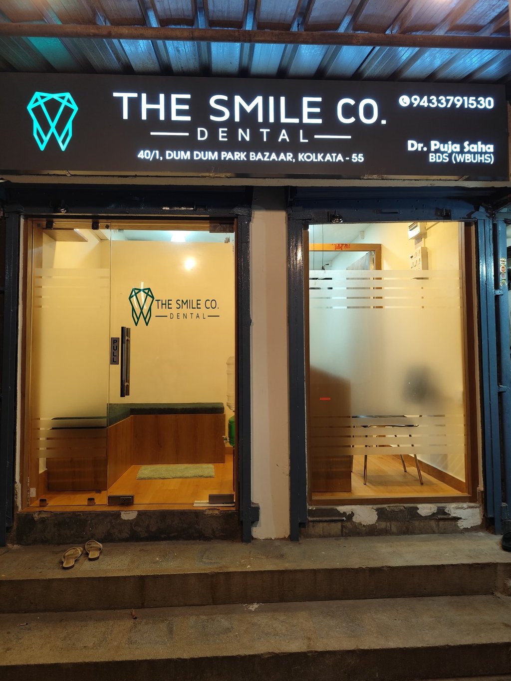 The Smile Co. Dental clinic storefront in Dum Dum Park, Kolkata, featuring a modern glass entrance.