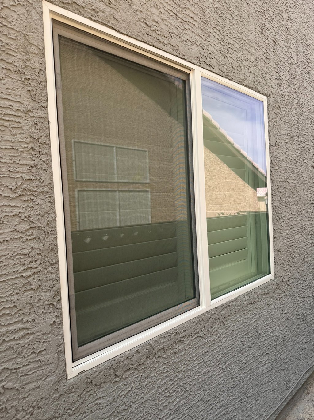 A window lacking a window screen and the privacy it provides