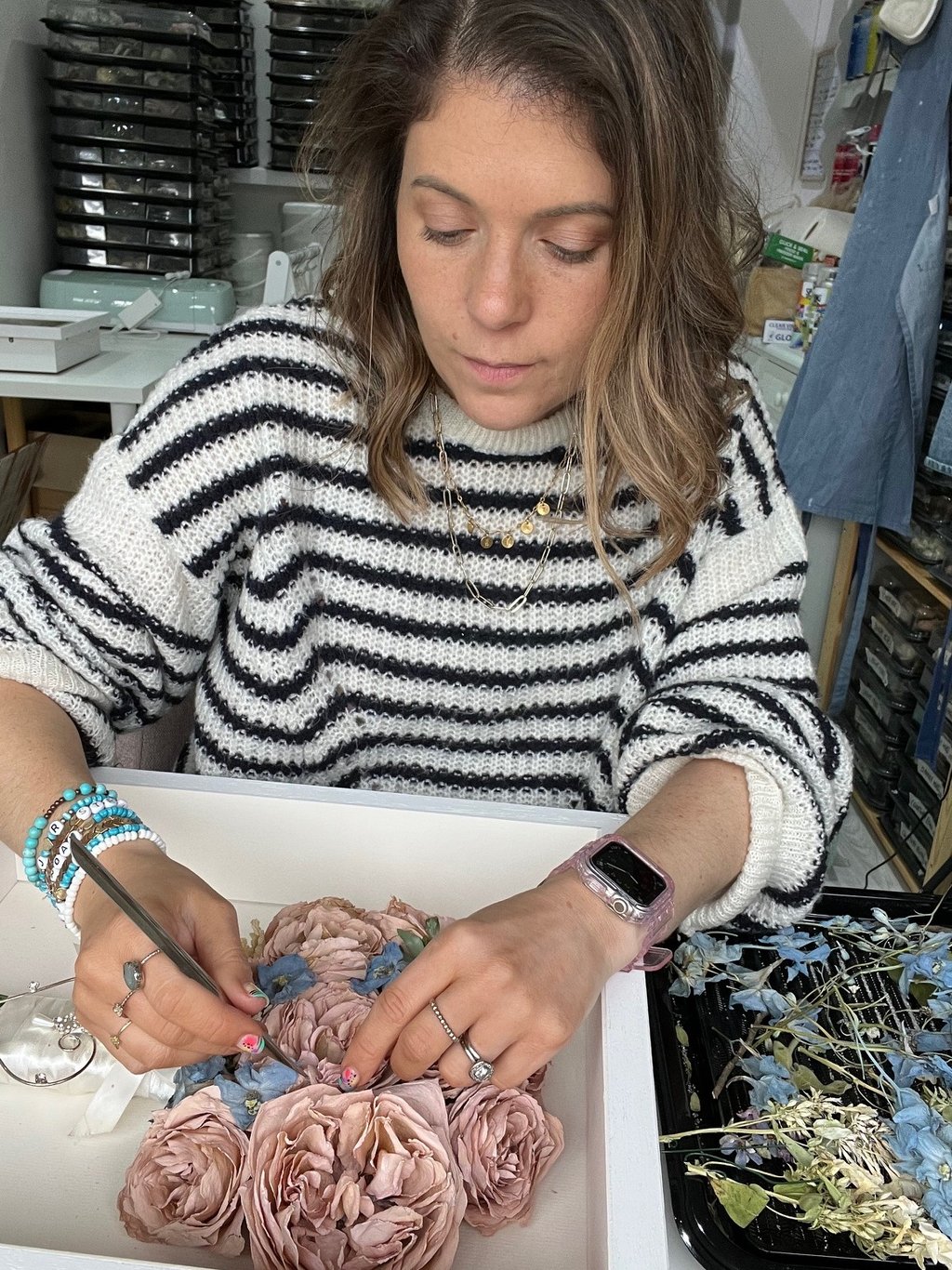 Jenny from Infinity Flowers expertly preserving a wedding bouquet