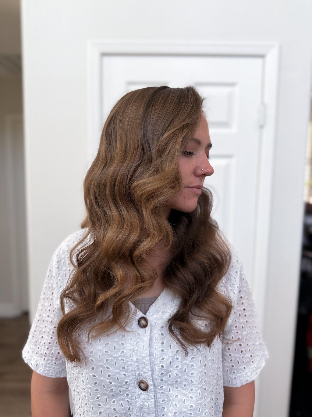 Modern romantic bride in Lodi winery suite with soft waves and pinned-back style