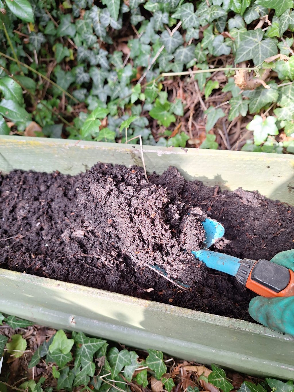 brown soil in a raised garden bed