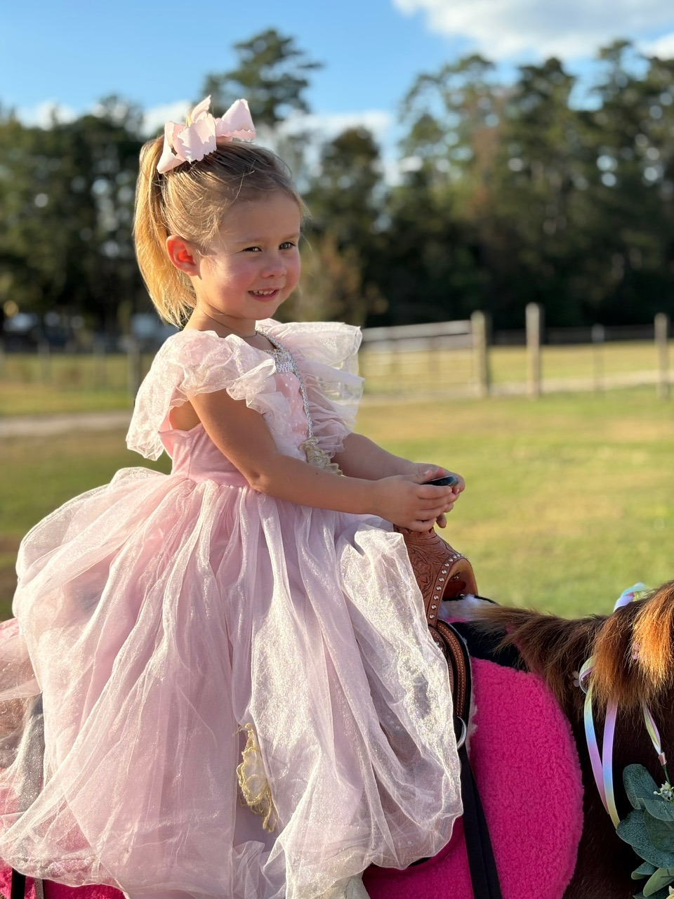 A preschool princess rides Snickers