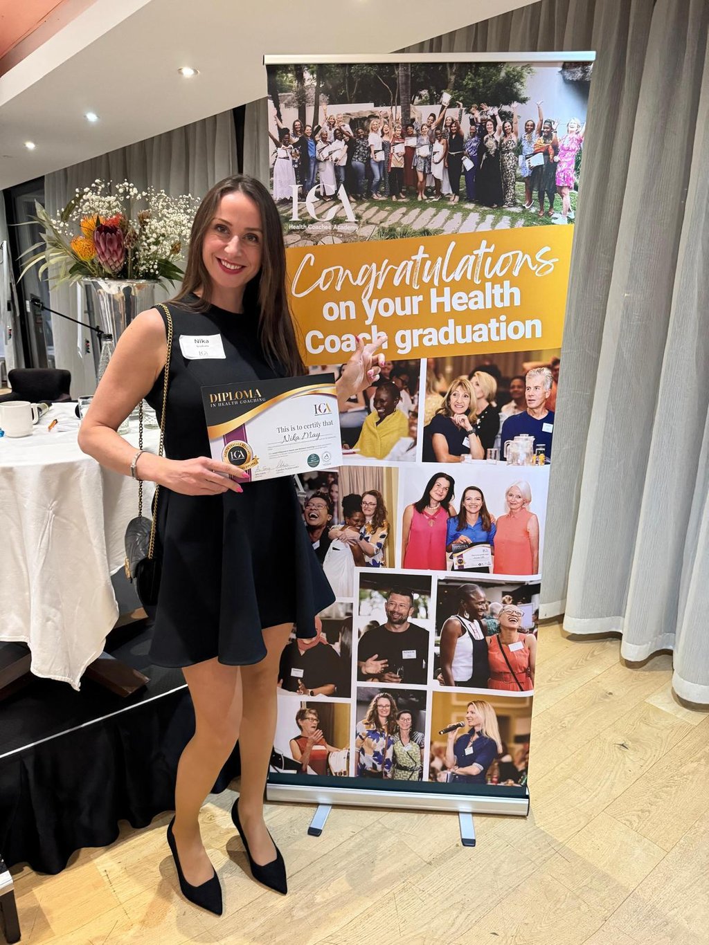 Nika May, qualified Health and Wellbeing Coach, at her graduation ceremony