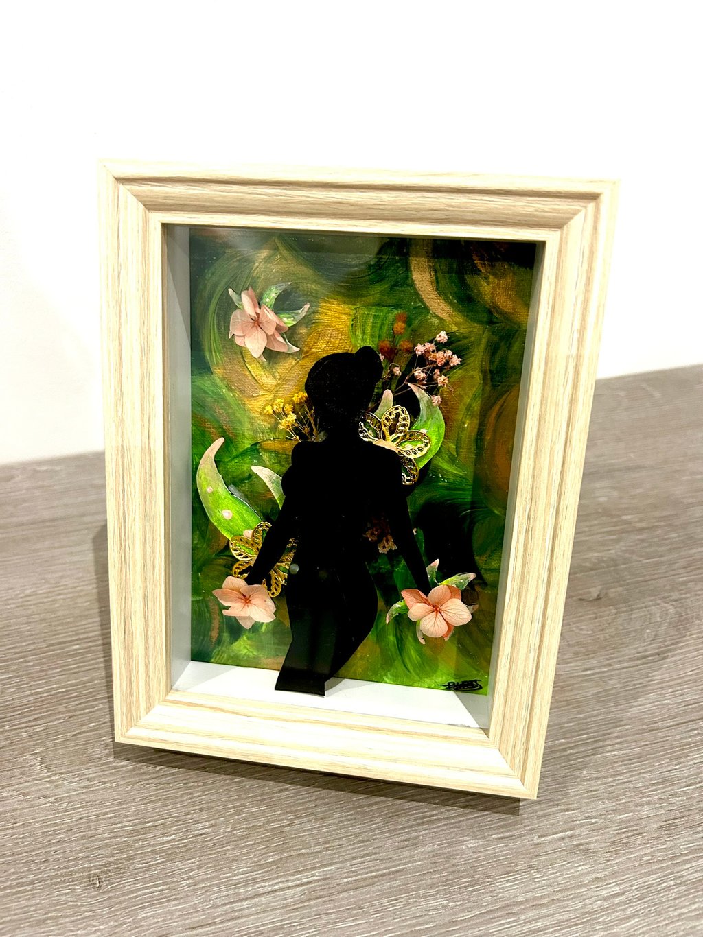 Ilona Paris painting, a shadow of a woman with flower