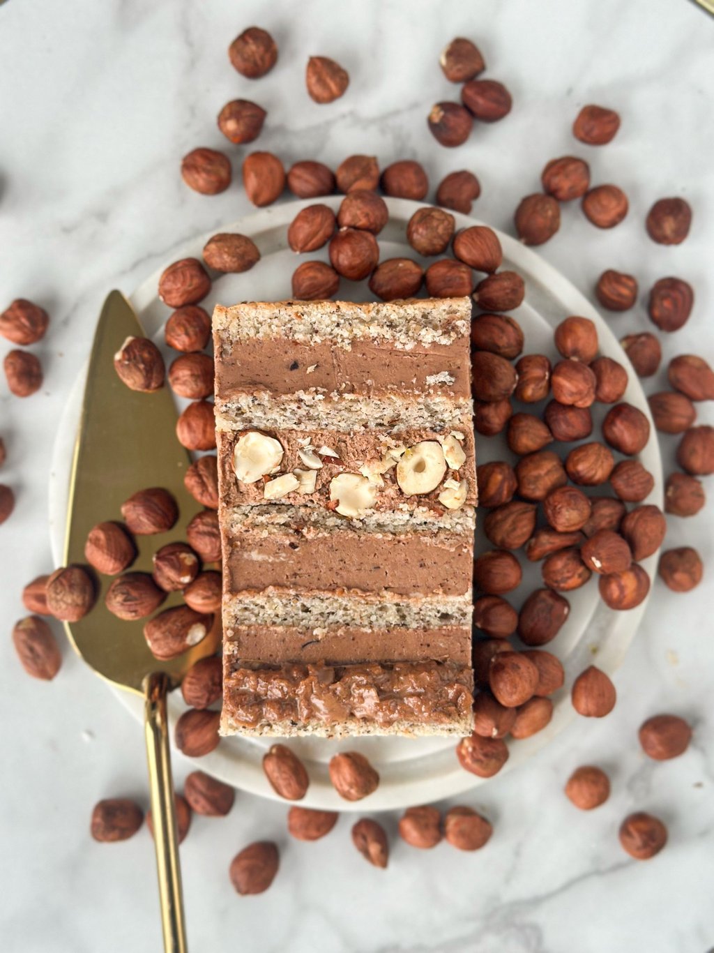 a piece of cake with nuts and nuts on a plate