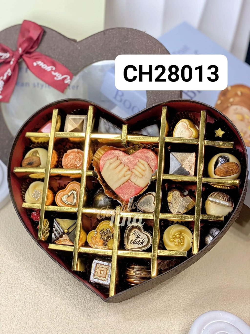 a heart shaped box with chocolates and candy