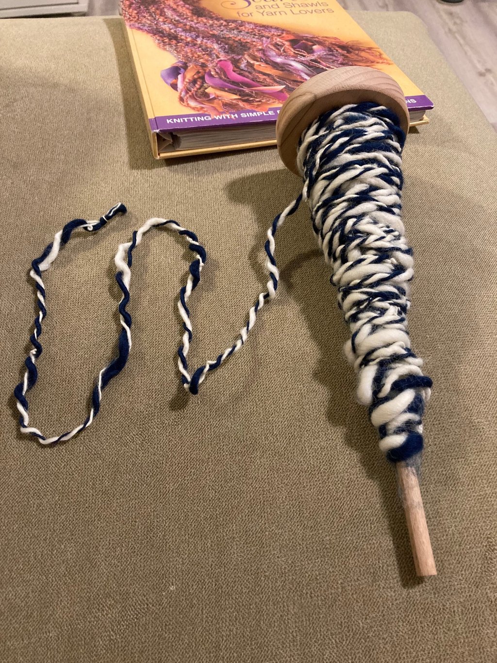 A beginner attempt at plying wool on an Ashford student spindle