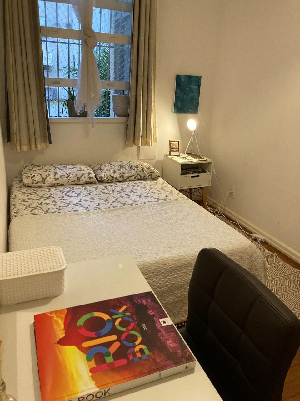 a bed room with a bed and a desk