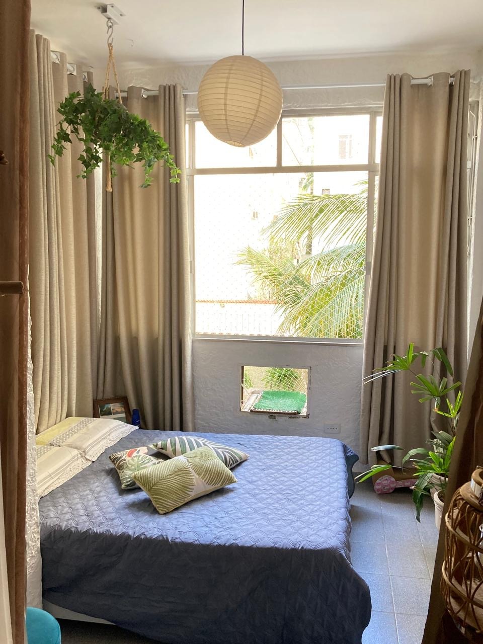 a bed room with a bed and a window