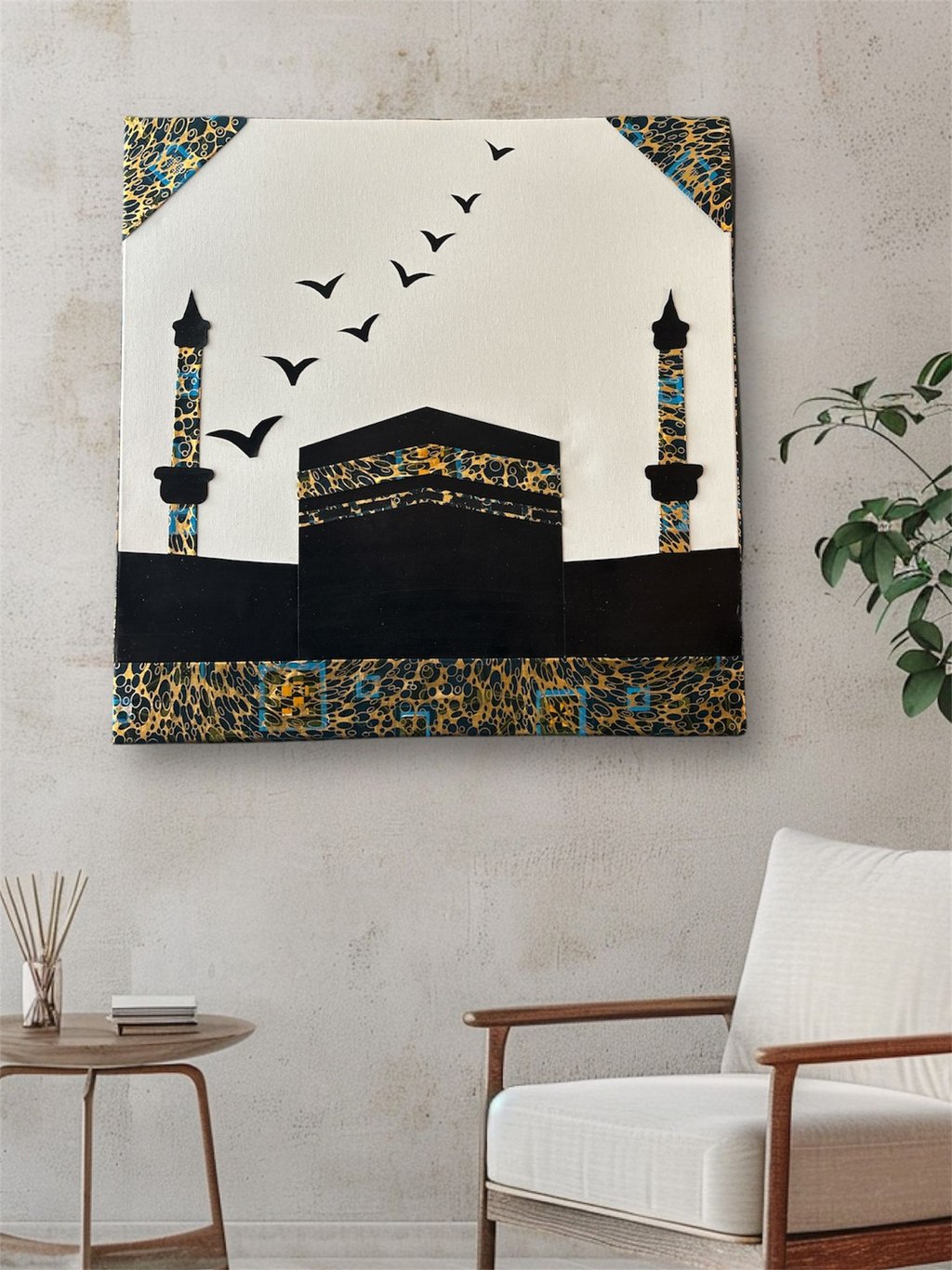 Modern Kaaba wall art with gold and blue patterns on a textured wall in a minimalist room.