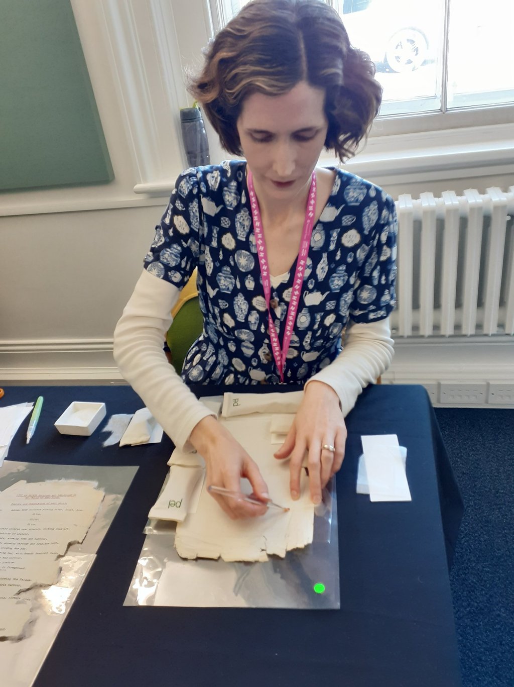 Mandy conserving a paper document