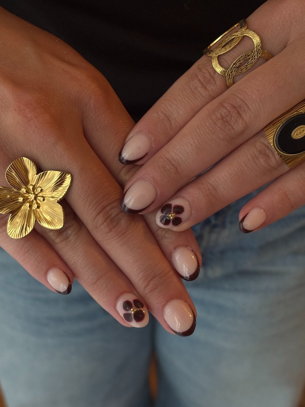 a woman's hands with rings and rings on her fingers