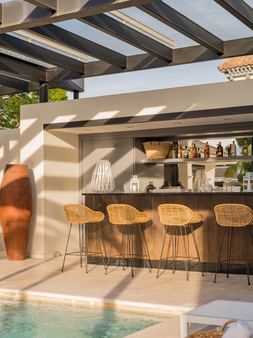 Outdoor bar and lounge area by the pool at Villa El Olivo, Marbella