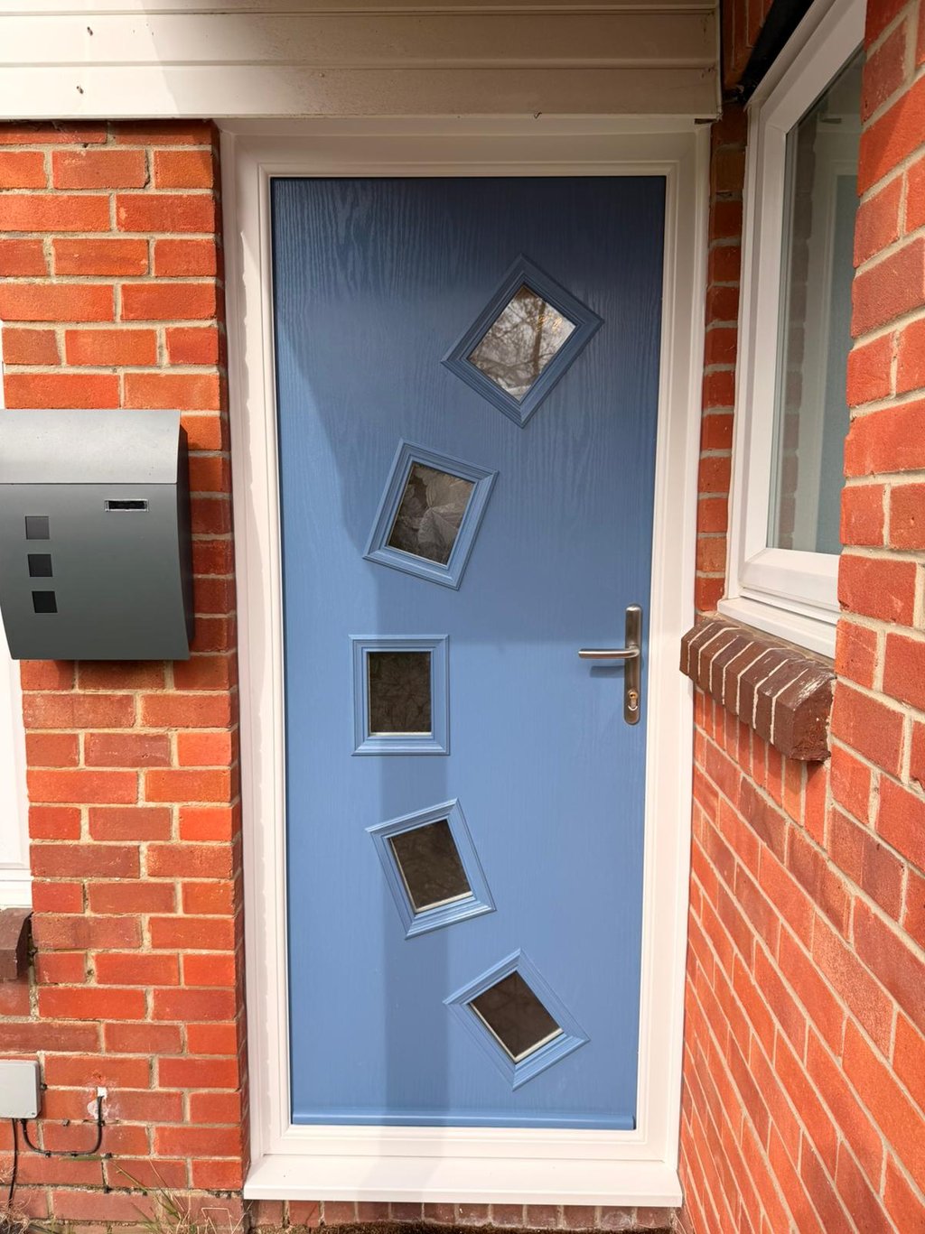 Pigeon blue front door with 5 glass panels in an arch fitted in Stubbington, Hampshire.