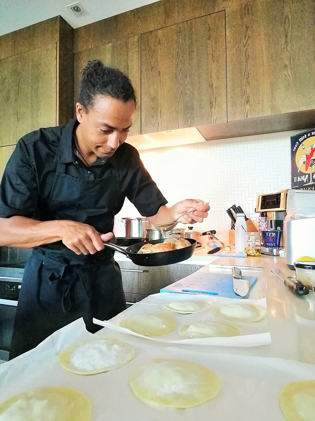 a chef is cooking with a pan