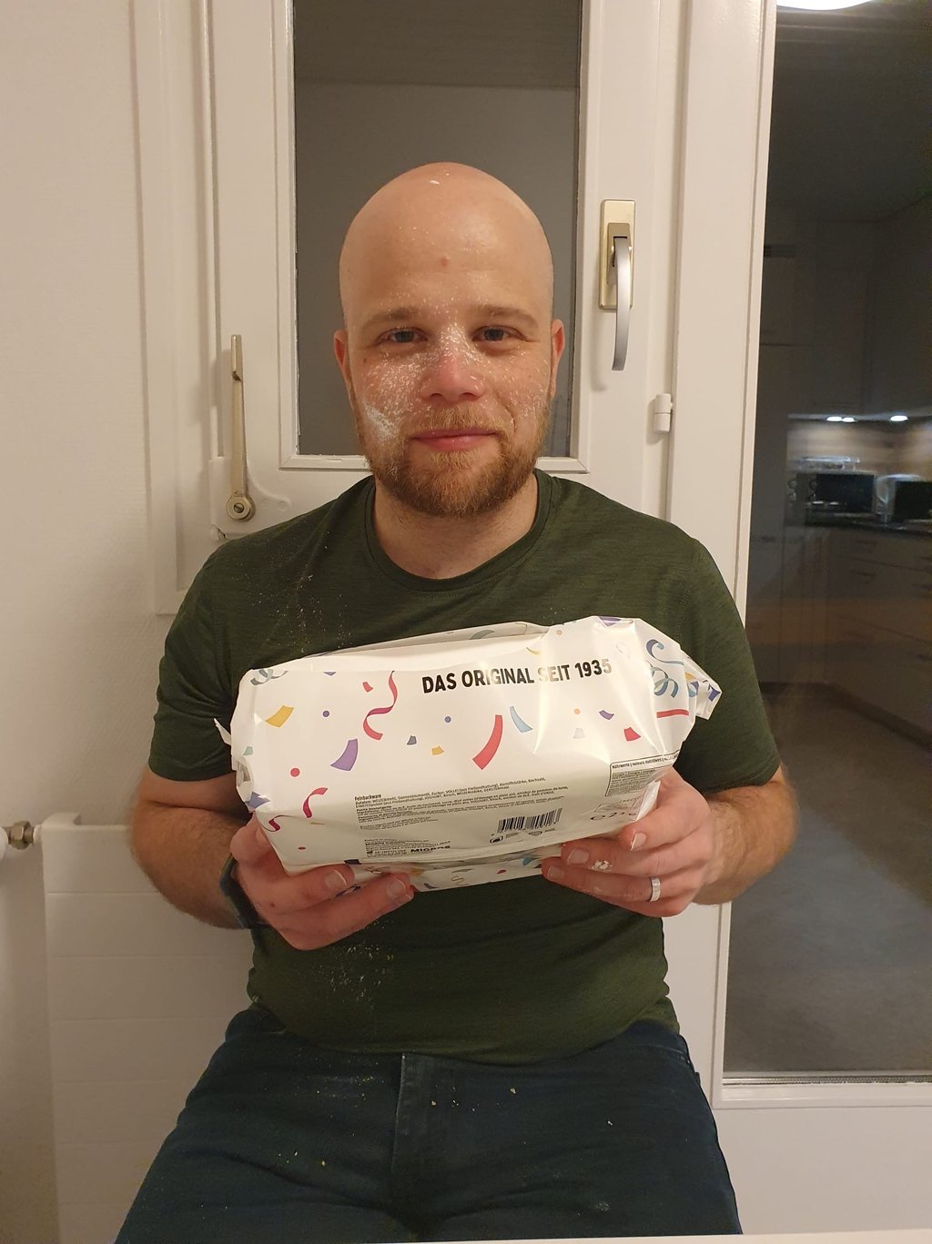 Colin from Hidden Switzerland Travel with a box of Fasnachtschüechli, traditional carnival food