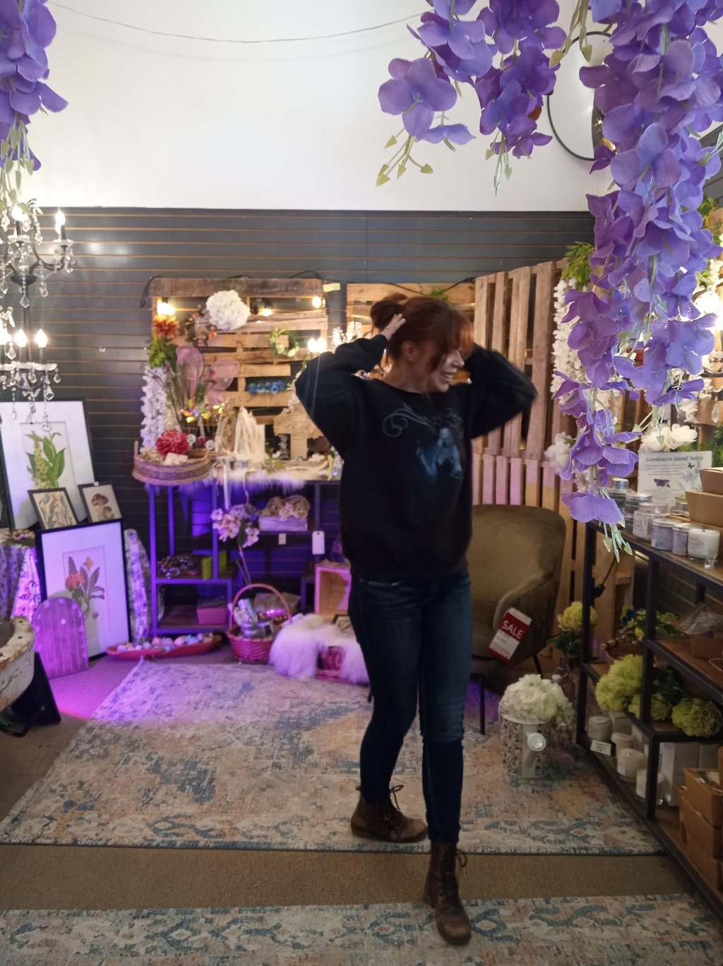 Maddy Fay Robinson hangs in the Fairy section of decor warehouses