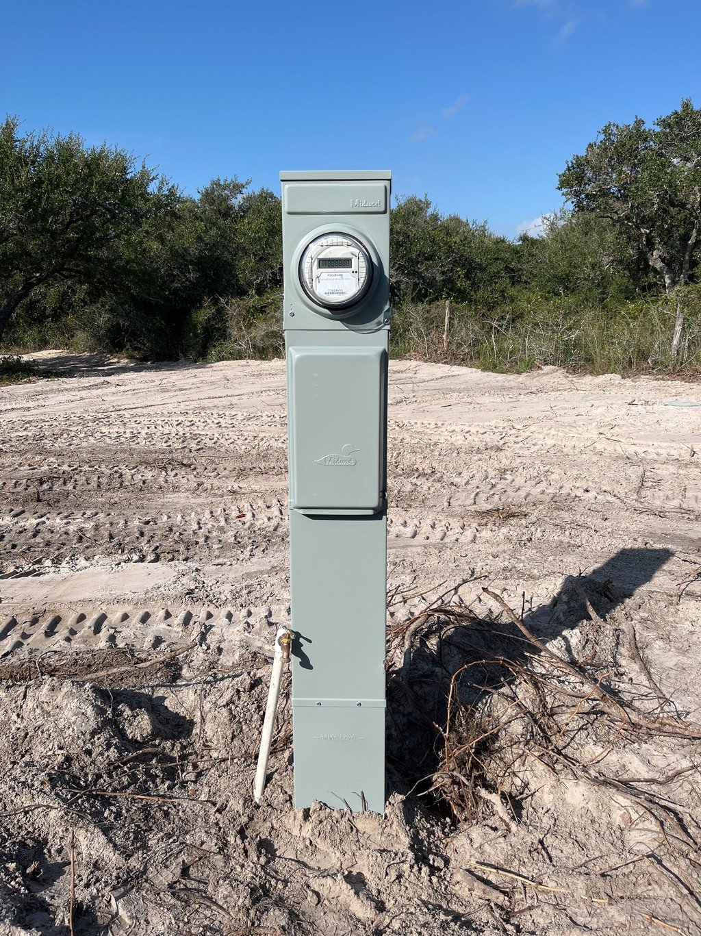 a cleared lot of land with an RV meter installed