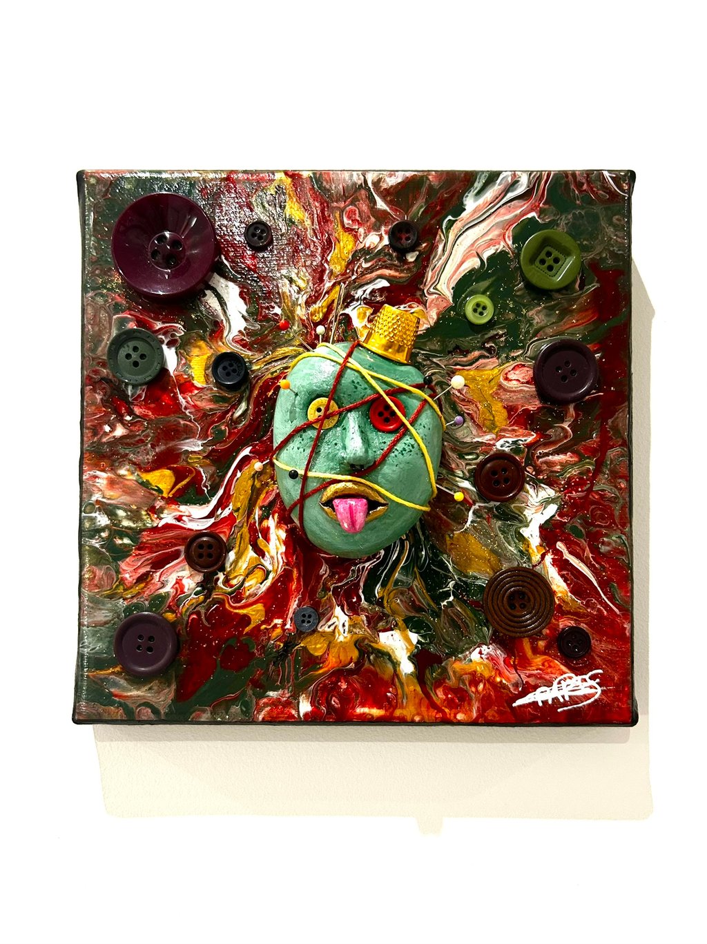 a painting of a face with buttons