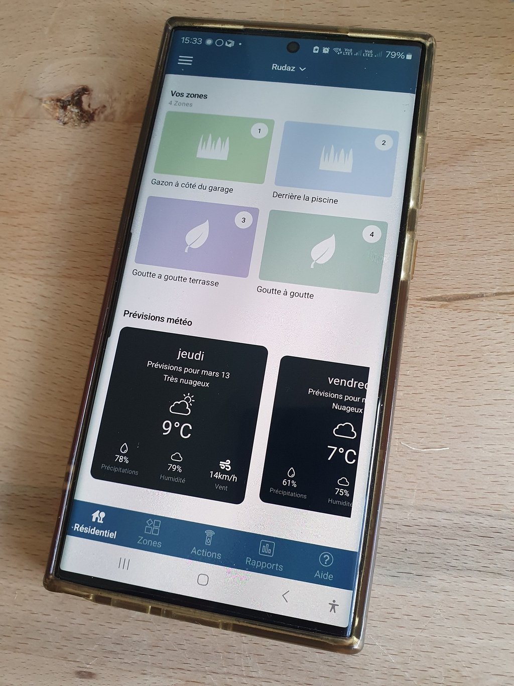 a phone with a phone showing a weather station