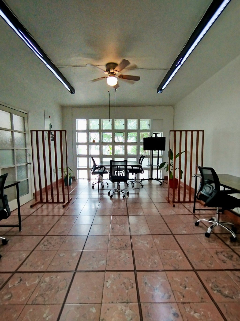 a office with a ceiling fan and a ceiling fan
