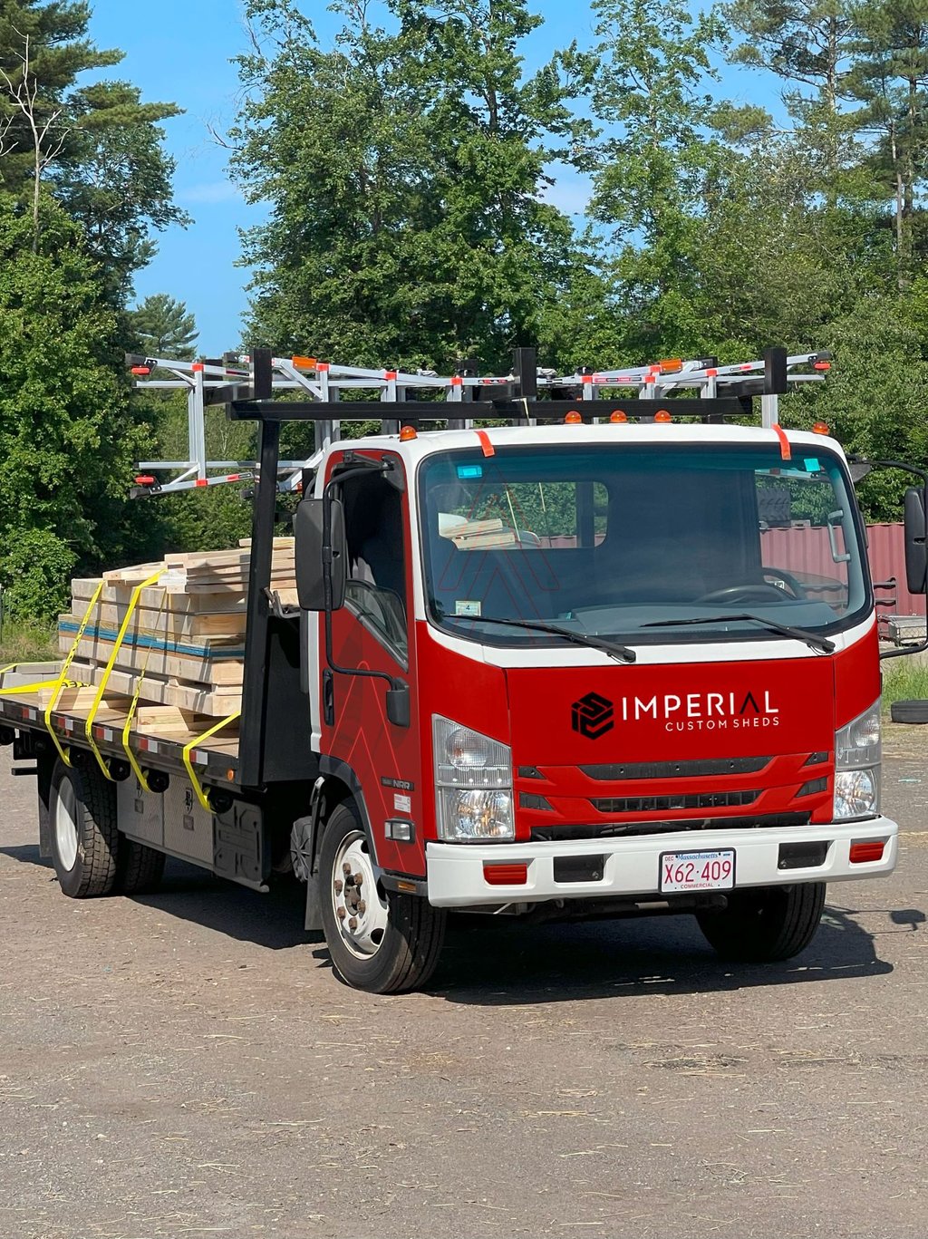 Shed on flatbed truck ready for on-site delivery and setup by Imperial Custom Sheds