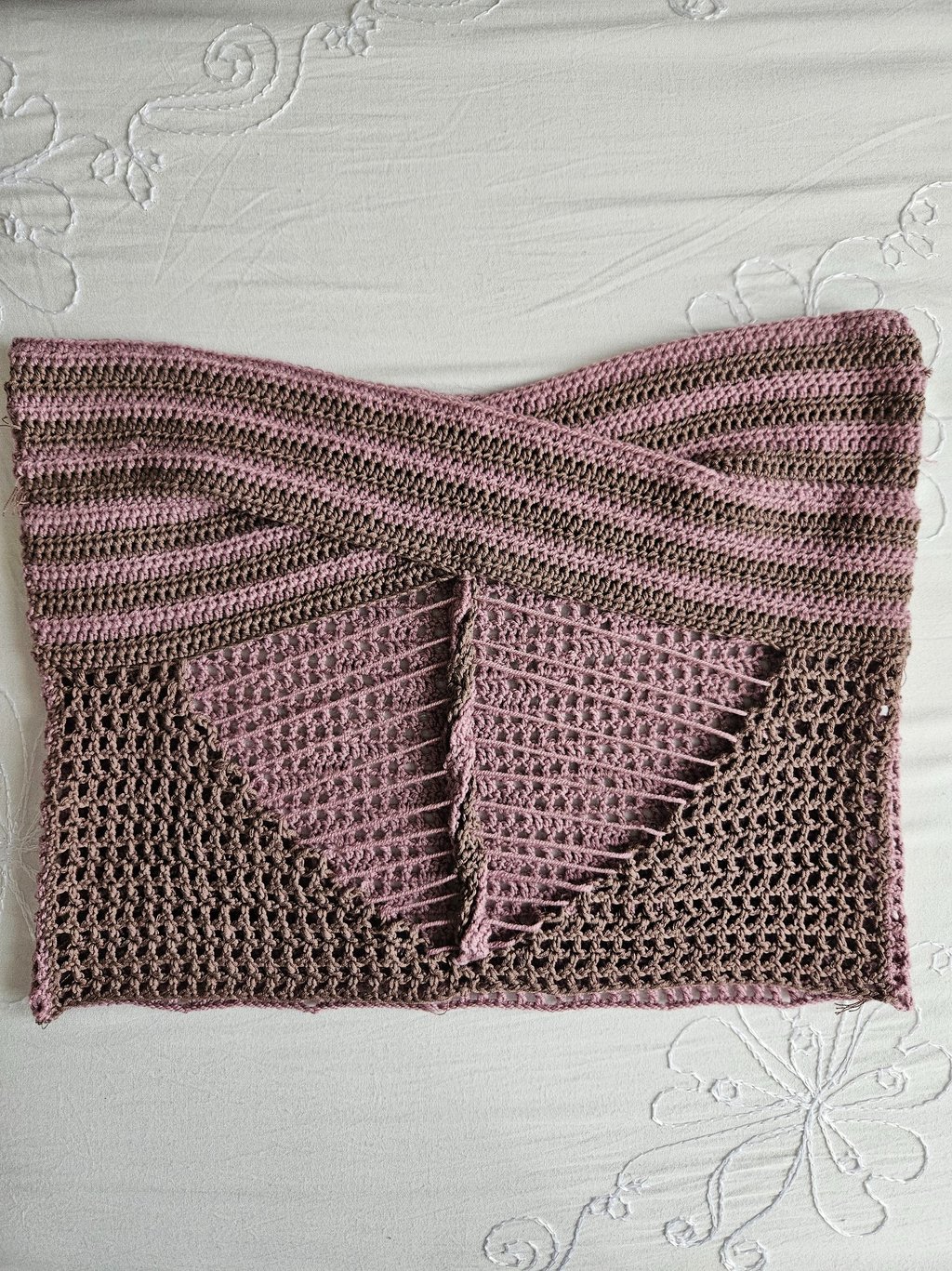 Handmade pink and brown striped crochet tube top with a cross-front design and mesh stitch detail.