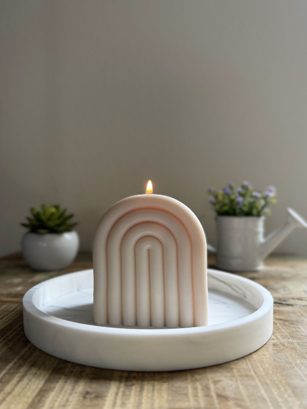 Arch candle lit over a plate